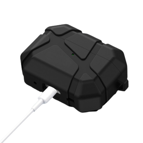 A rugged black electronic device with a textured, protective casing, shown with a white charging cable plugged into one of its ports against a white background.